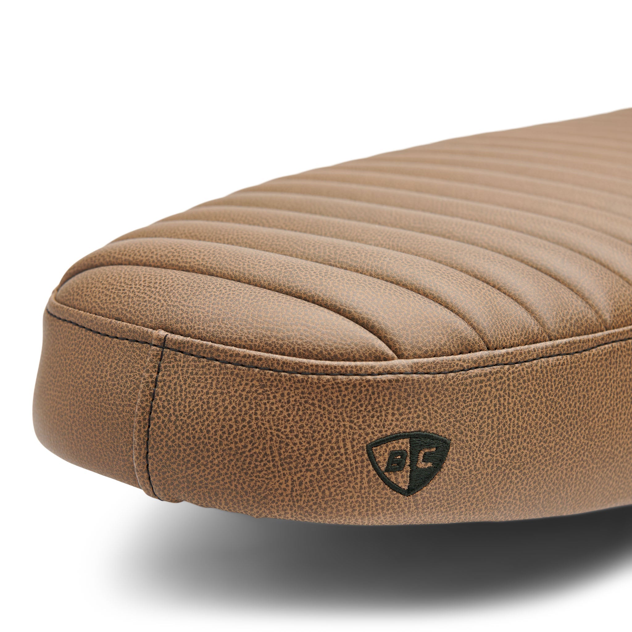 Underside of the brown Slammer 2.0 seat showing the factory mounting points