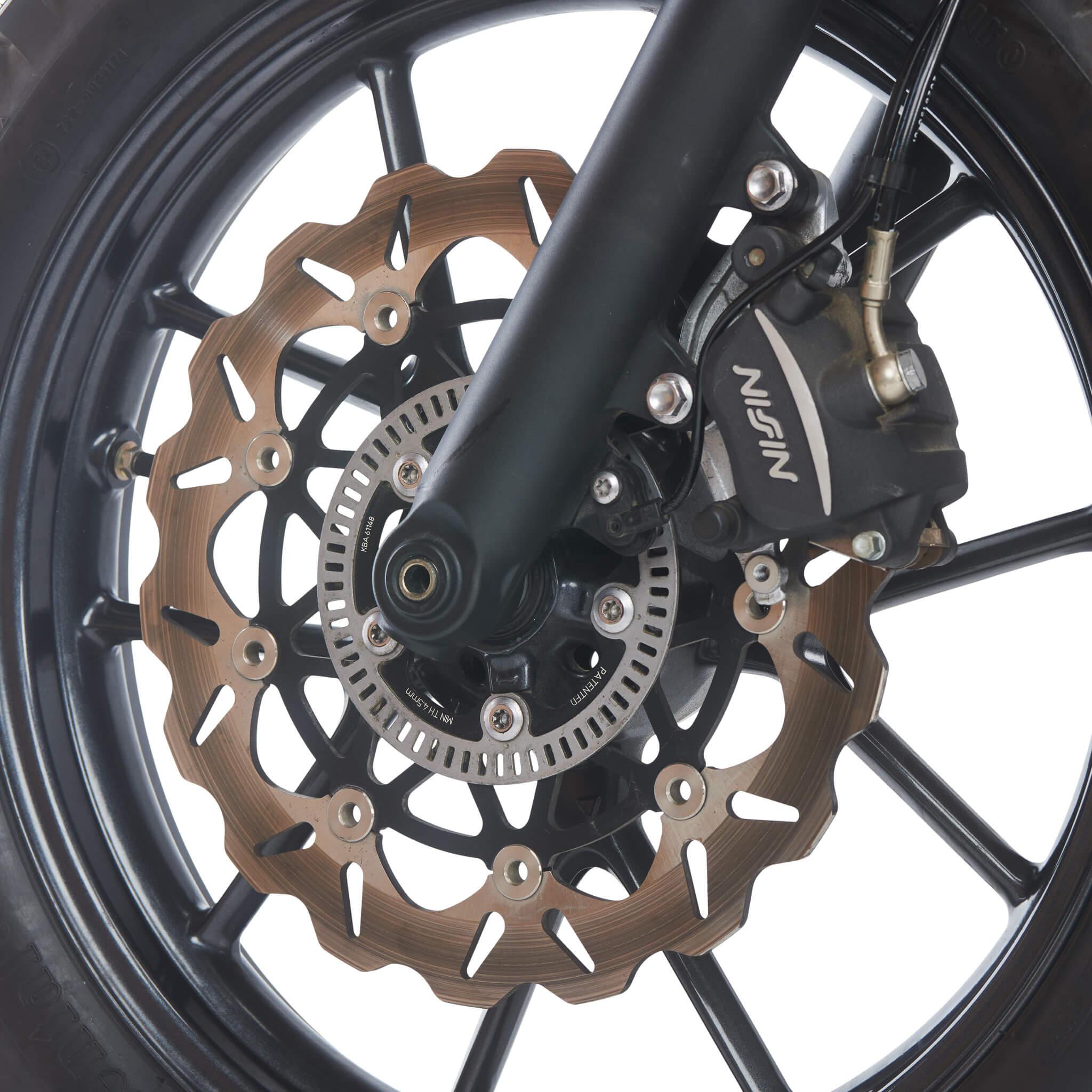 Galfer wave rotor fitted to a Triumph front wheel with Nissin caliper, rotor face heat coloured bronze