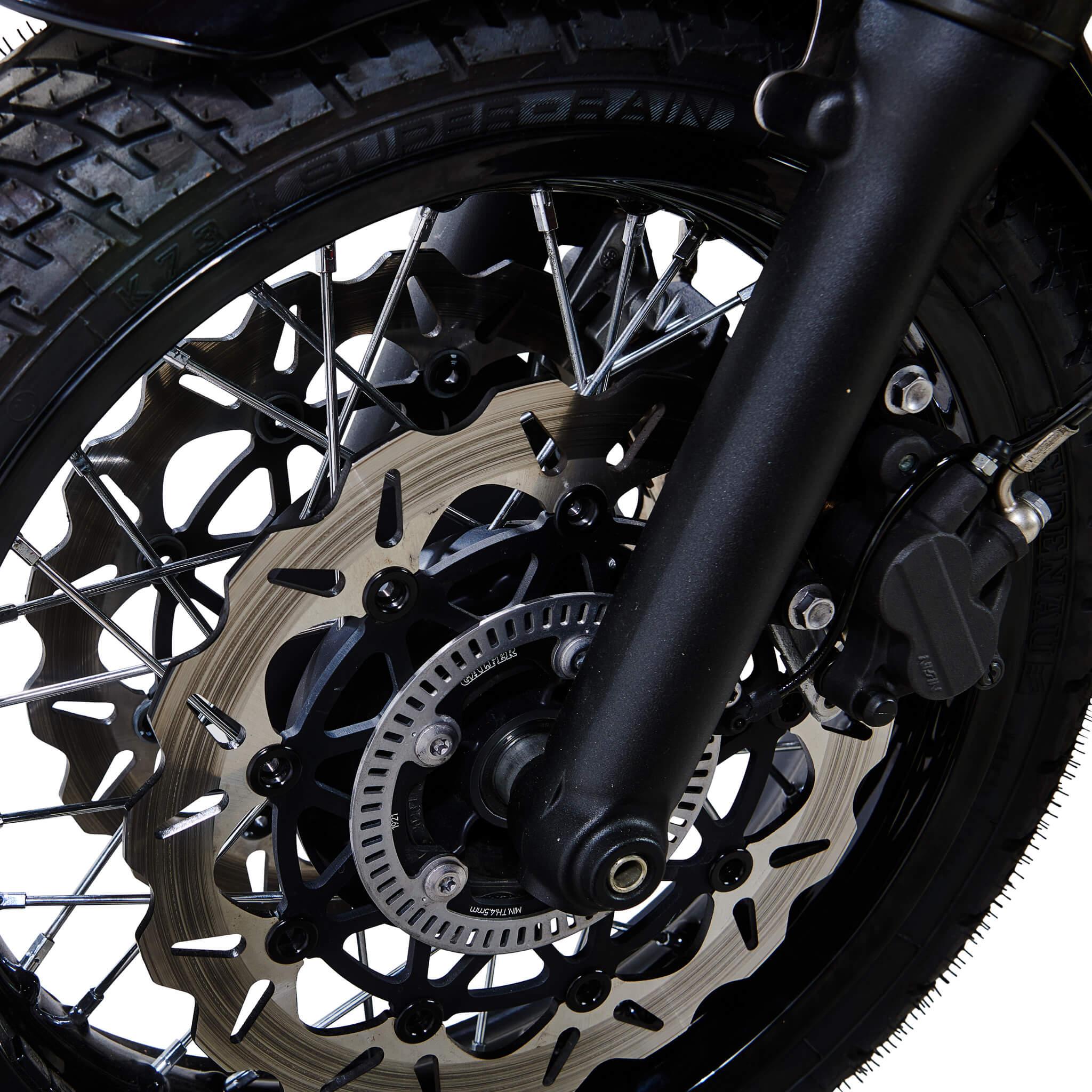 Dual Galfer front wave rotors mounted either side of the hub on a black spoked Triumph wheel