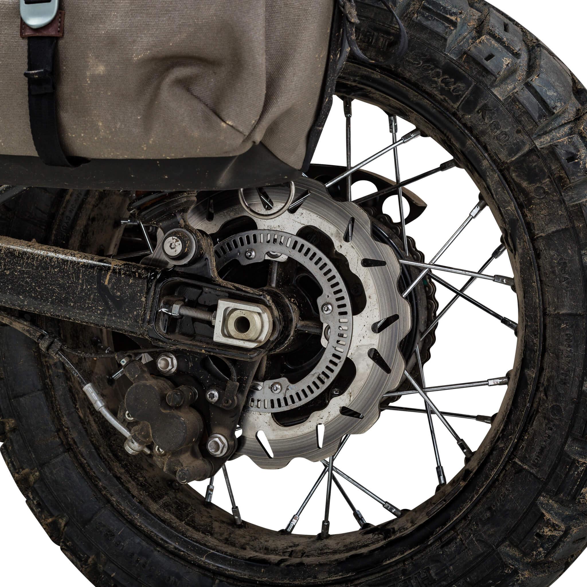 Muddy Triumph adventure rear wheel with knobby tyre, Galfer wave rotor and canvas pannier